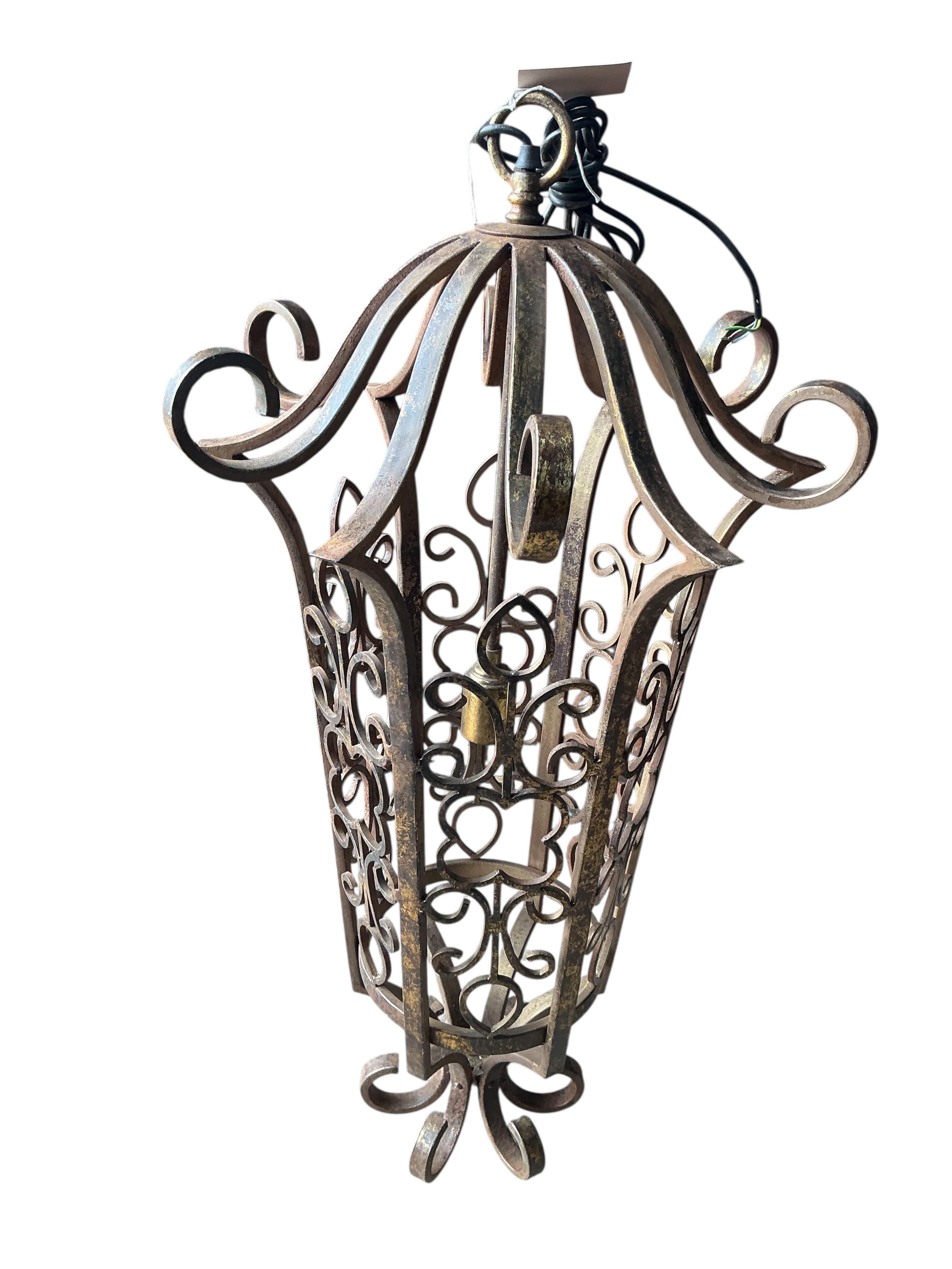 A wrought iron hexagonal hall lantern, height 90cm